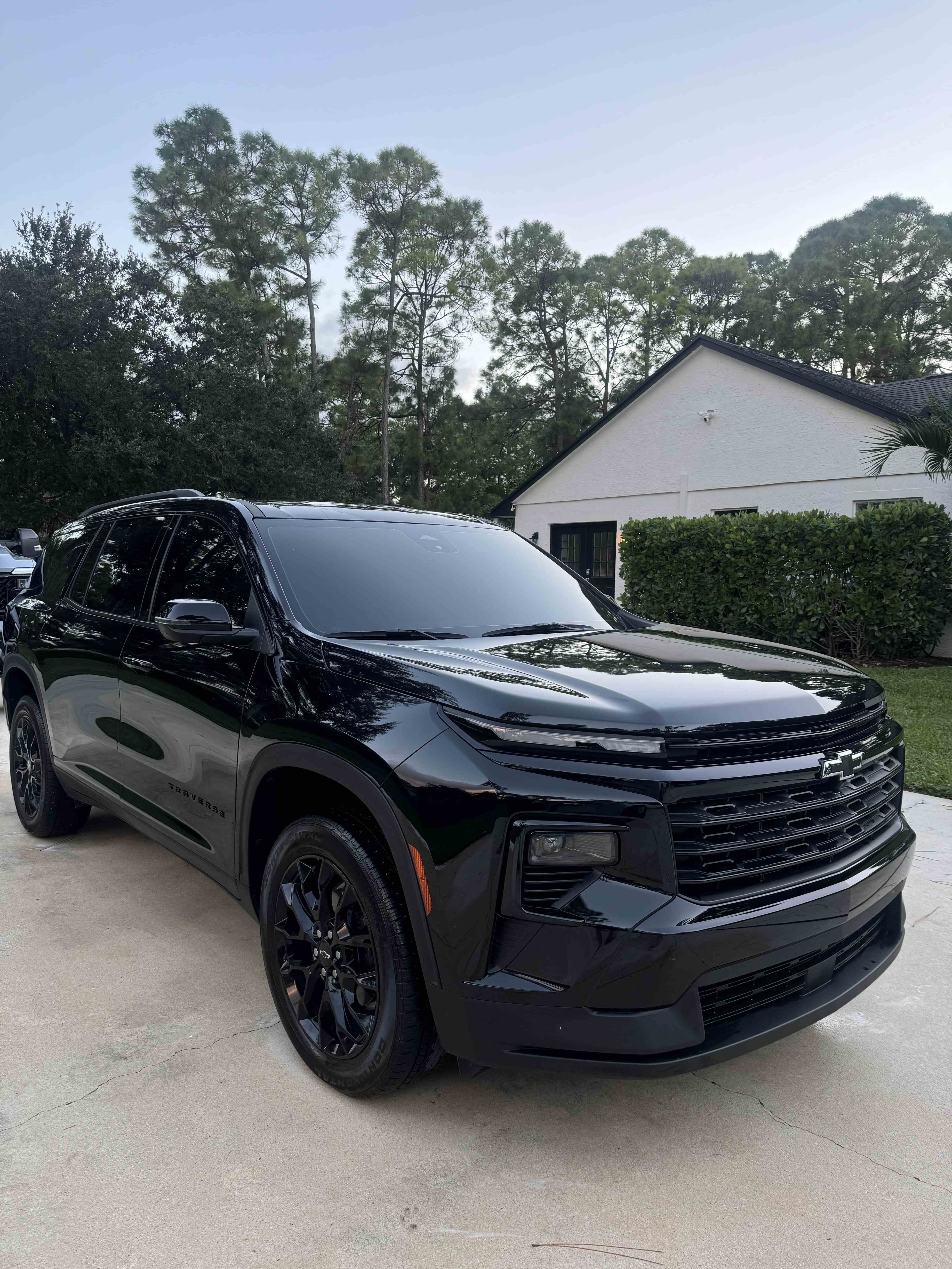 Glossy black Chevrolet Traverse after a detail